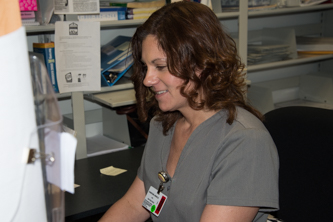 A nurse enters information into the system